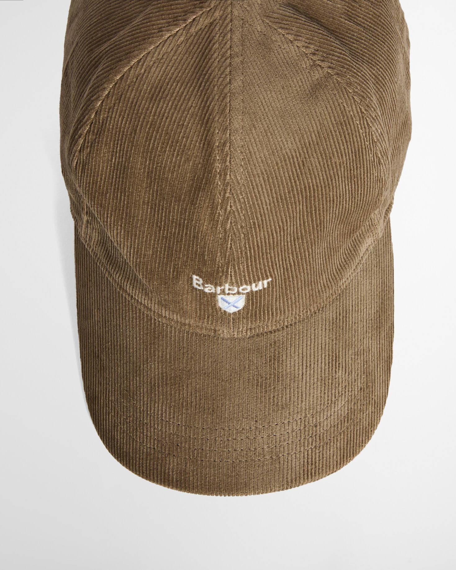 Beige kordfløyel caps forfra, viser buet brem og klassisk seks-panel design.